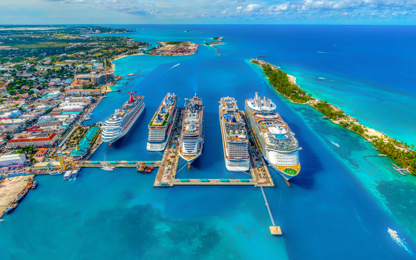 Several cruise ships docked in a turquoise harbour