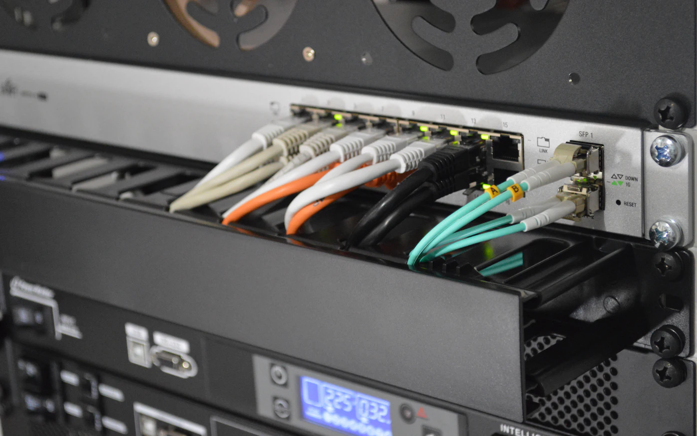 Network switch with patch cables plugged into its ports