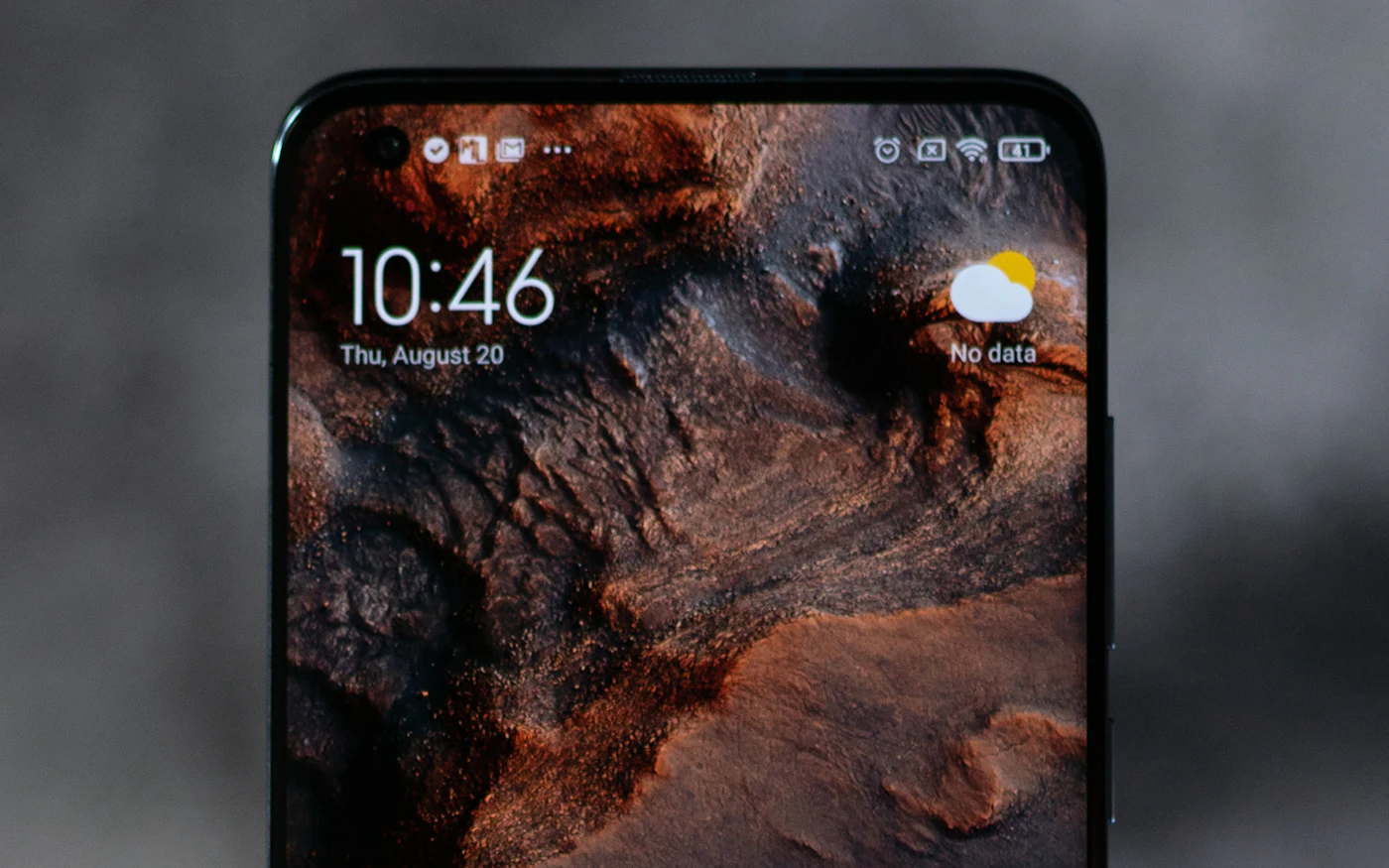 Smartphone home screen on a dark background