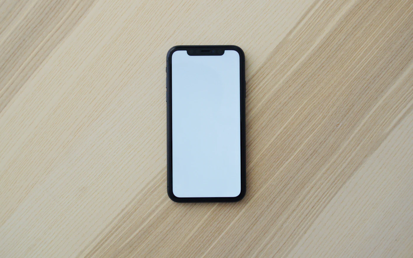 Smartphone lying on a wooden table